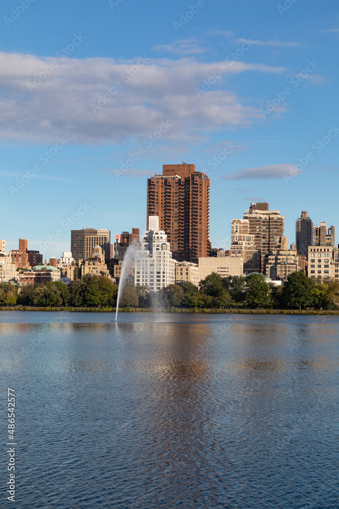 Central Park Reservoir and Fountain with the Upper East Side Skyline in New York City Central Park Reservoir and Fountain with the Upper East Side Skyline in New York City