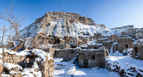Old cave churches and Yaprakhisar houses view in Aksaray Province of Turkey photo