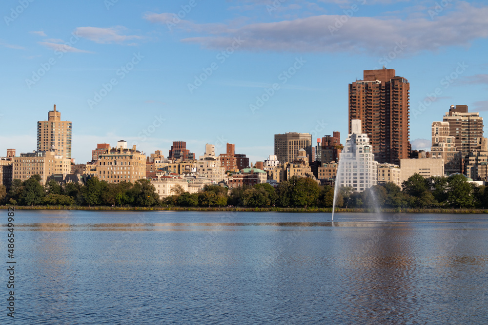 Central Park Reservoir and Fountain with the Upper East Side Skyline in New York City Central Park Reservoir and Fountain with the Upper East Side Skyline in New York City