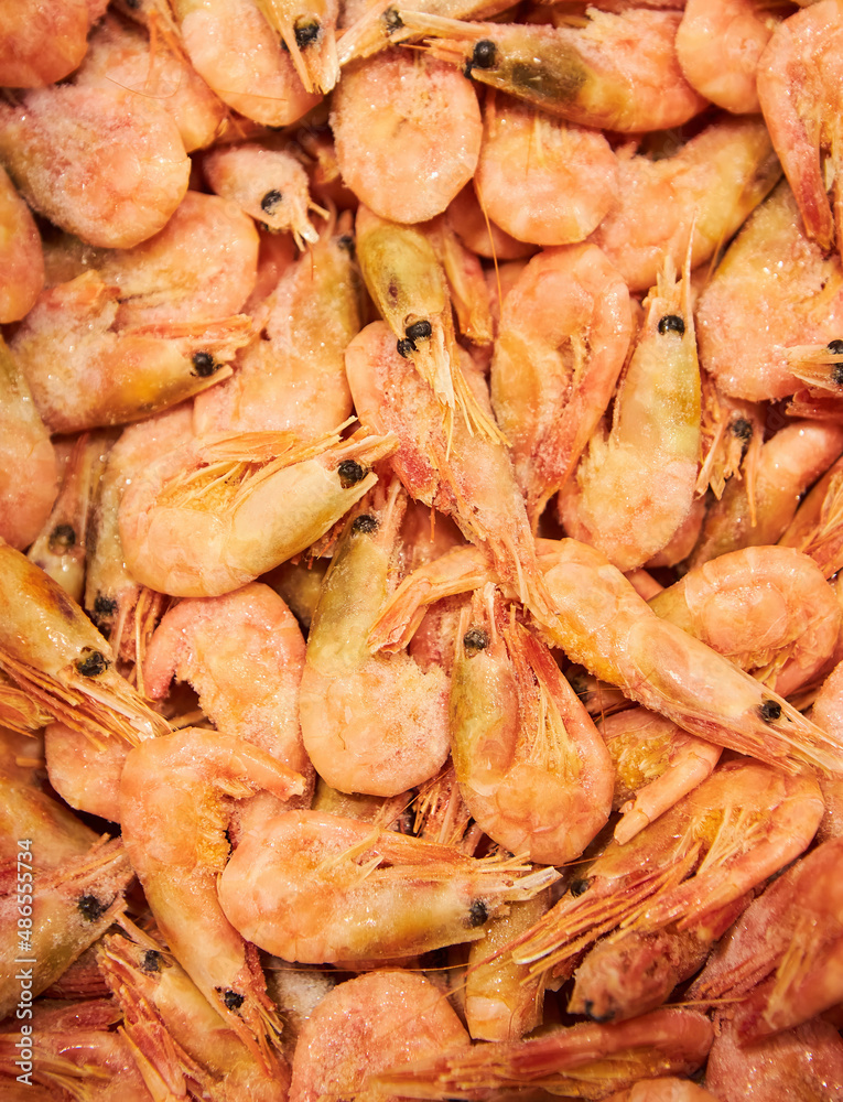 Boiled shrimp, top view. Raw frozen foods. A delicacy. Boiled shrimp, top view. Raw frozen foods. A delicacy.
