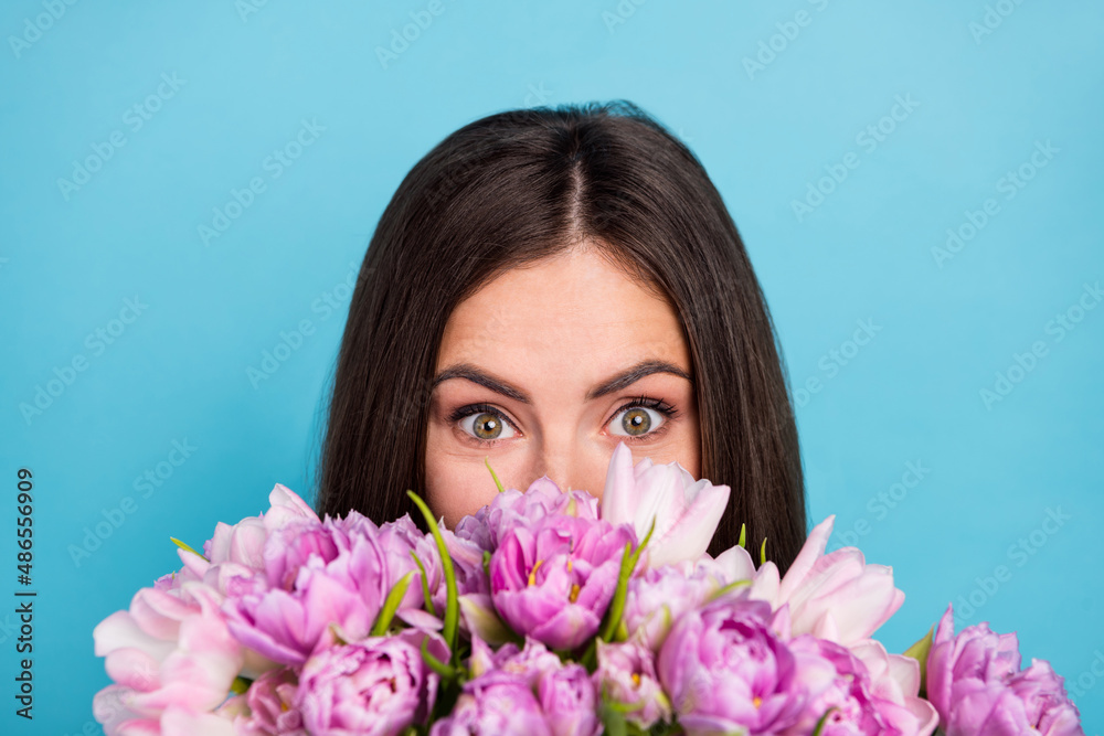 Cropped closeup photo of attractive cute girl receive tulips and peony bouquet isolated on blue color background
