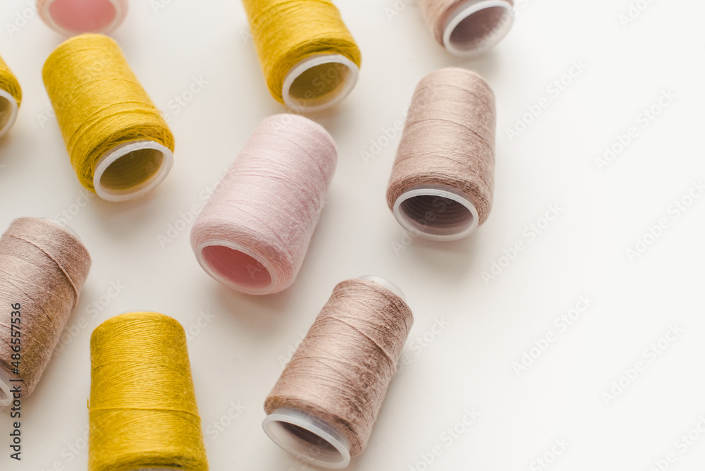 Spools of thread on a white background. Colored threads. Spools of thread on a white background. Colored threads.