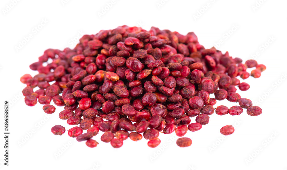 Sumac seeds isolated on white background. Whole dry Rhus berry. Sumac seeds isolated on white background. Whole dry Rhus berry.