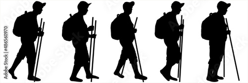 An elderly woman with a backpack on her back, a cap on her head, walking sticks in her hands. Woman on the move, step by step. Hiking. Side view. Black female silhouettes on a white background.