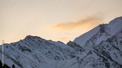 Cloudy dawn over a mountain peak