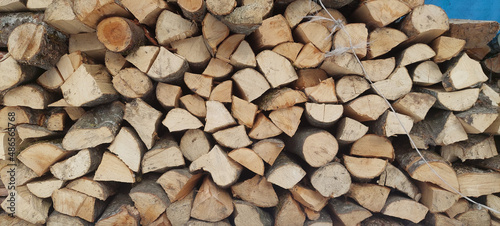 Stack of firewood to fuel an indoor fireplace.