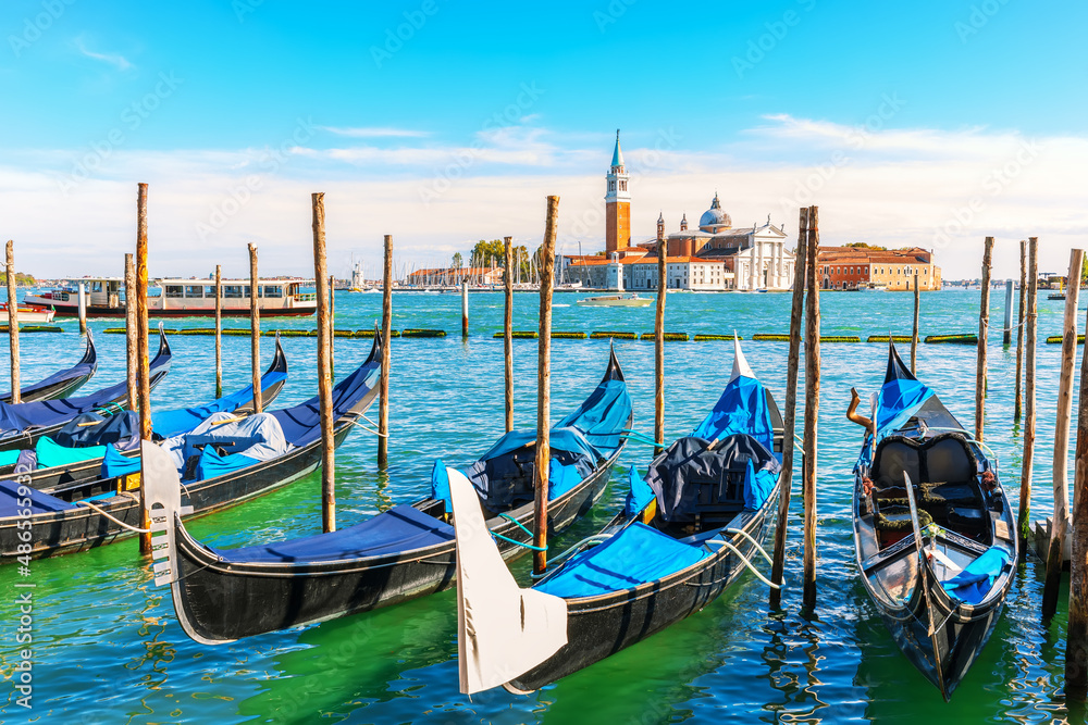 Gondolas moored in the lagoon of Venice not far from San Giorgio Maggiore Island, Italy