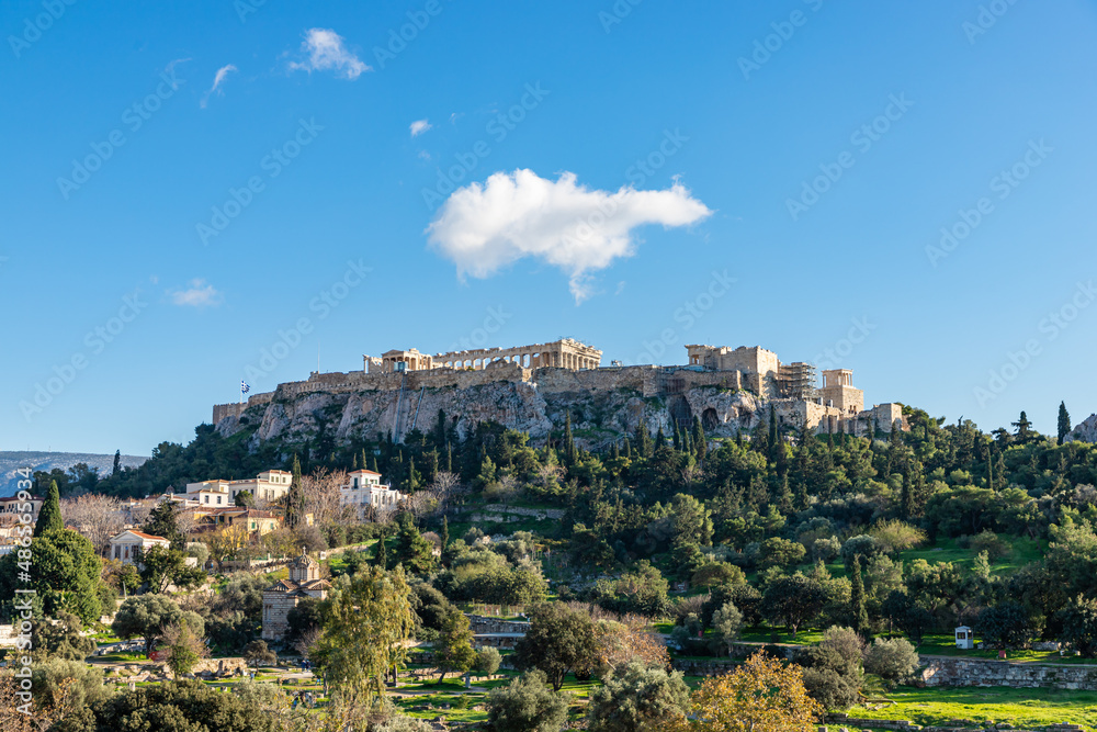 Panorama of the Acropolis. Ancient Greek Parthenon on Acropolis hill is a top landmark of Athens. Scenery of the famous monuments in the Athens center in summer. Landscape with ruins