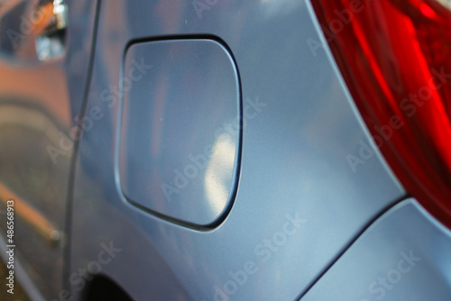 Close-up view of the cap cover fuel tank of baby blue modern car