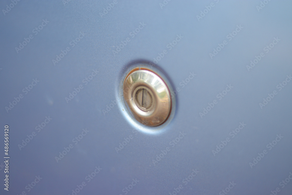 Close-up view of the car door key slot of baby blue modern car Close-up view of the car door key slot of baby blue modern car
