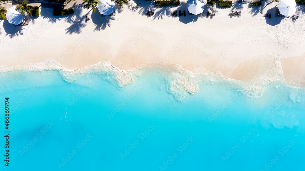 Aerial top down view of the turquoise sea of Cape Santa Maria beach on Long Island, The Bahamas