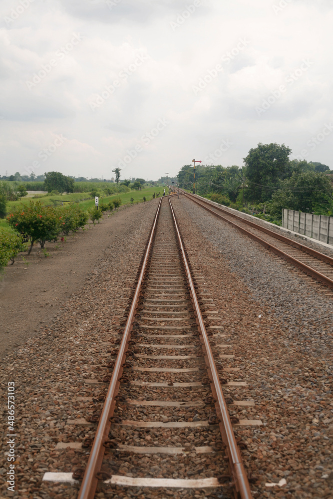 railroad tracks in the countryside in java Indonesia railroad tracks in the countryside in java Indonesia
