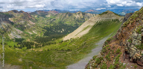 Hidden Valley - A panoramic view of remote and colorful Oh-Be-Joyful Valley, as seen from Scarp Ridge Trail on a stormy Summer afternoon. Crested Butte, Colorado, USA.  © Sean Xu