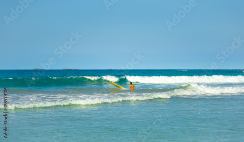 Beautiful sea waves in the blue ocean. Sea element on a sunny summer day. Travel by sea in good weather. Active rest on the sea waves.