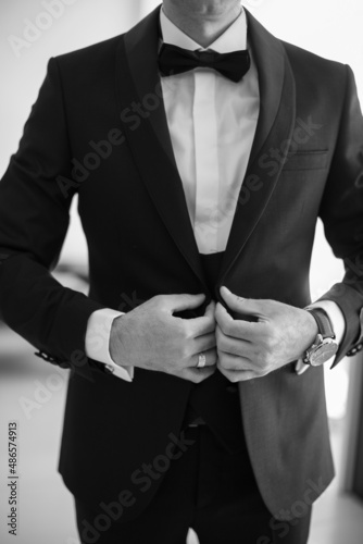 Groom in suit, black and white