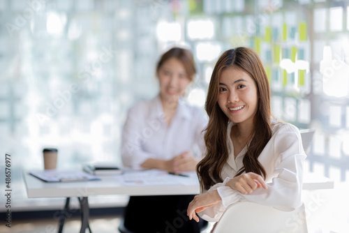Free Download Beautiful Asian woman is a businesswoman who leads a new generation of startups, a woman who runs and manages a business plan to build confidence and stability in business, woman-led business concept. - GFXLoad