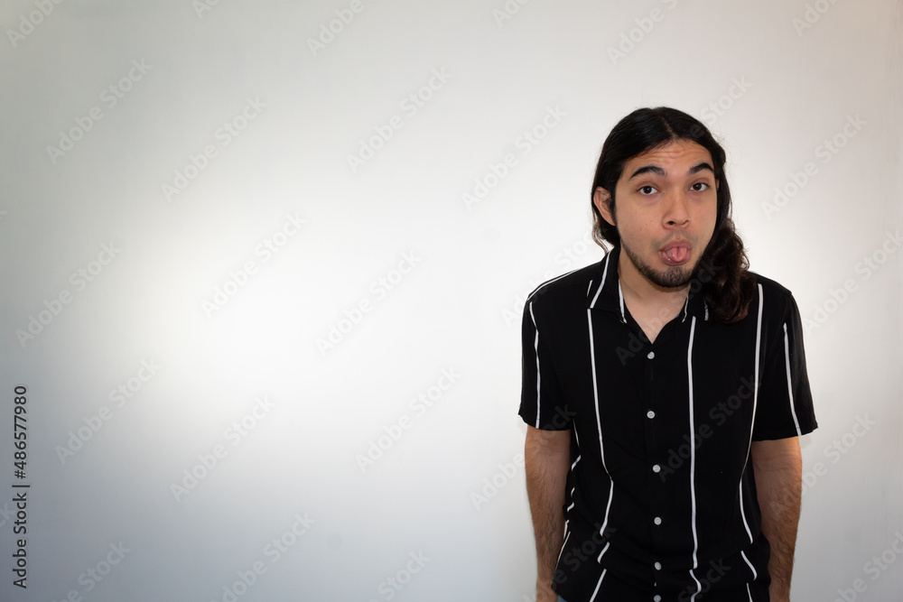 portrait of a hispanic non binary man on a white background