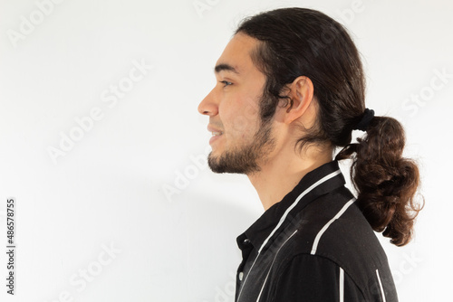 portrait of a young hispanic man smiling very happy on a white background