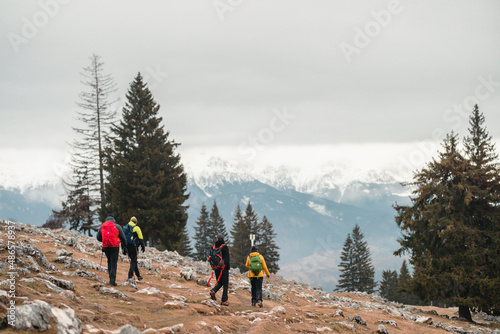 Climbers in winter mountains. Team of hikers were fully equipped for winter mountain climbing. Outdoor climbing hike trekking snow trip. People hiking in beautiful mountain winter landscape © Damian