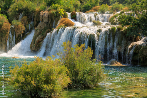 View of waterfall cascade on a sunny day in Krka National Park, Croatia