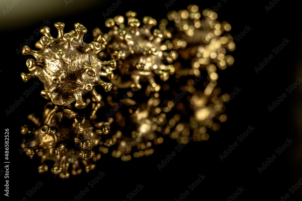 Strong angry virus with a face. The coronavirus is slightly blurred. A type of virus made of metal Strong angry virus with a face. The coronavirus is slightly blurred. A type of virus made of metal