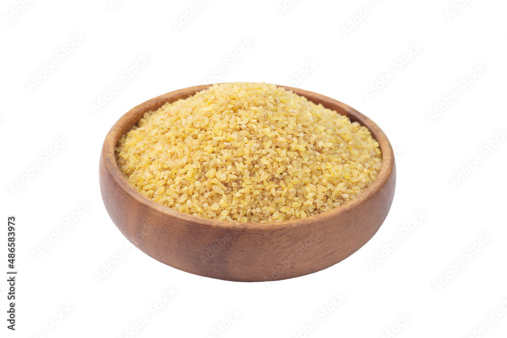 Bulgur in wooden bowl, isolated on white Bulgur in wooden bowl, isolated on white