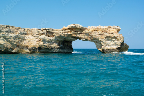 Rock in Aegean sea near Rethymno city, Crete, Greece