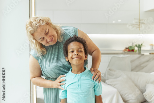 Happy mom and child boy at home