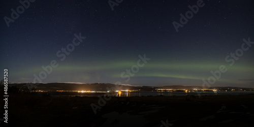 a view of the aurora borealis in the north west highlands of scotland during a clear spring night