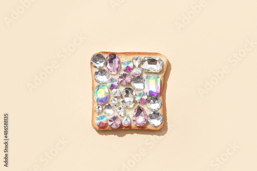 Shiny sparkling gemstones on baked toast