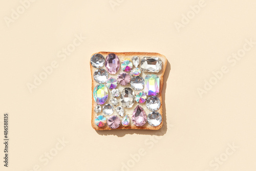 Shiny sparkling gemstones on baked toast photo