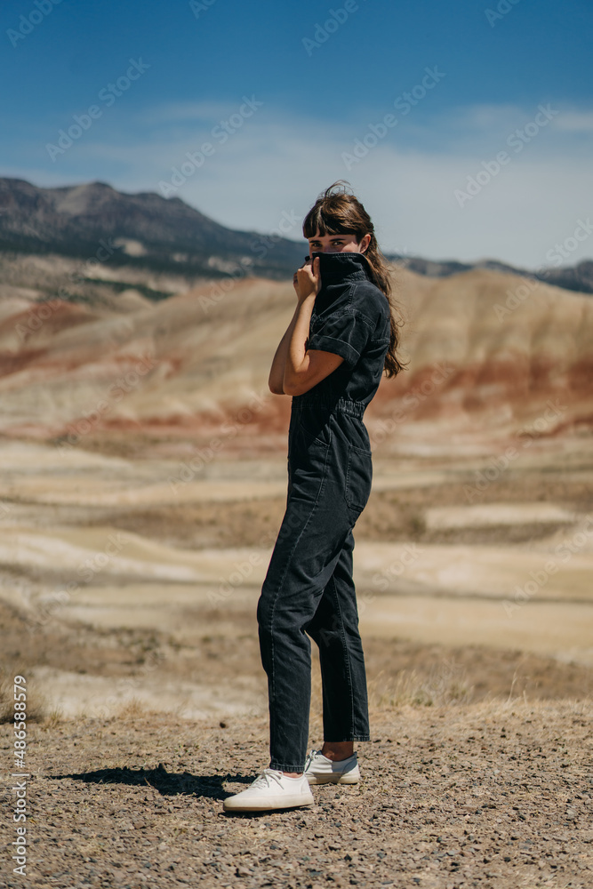Person in Jumpsuit Hiding Face Person in Jumpsuit Hiding Face