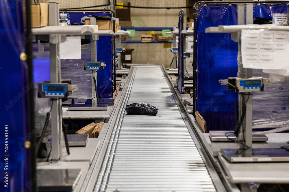Conveyor Belt with package at ecommerce warehouse Conveyor Belt with package at ecommerce warehouse