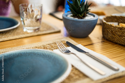 Served table with cutlery in restaurant photo