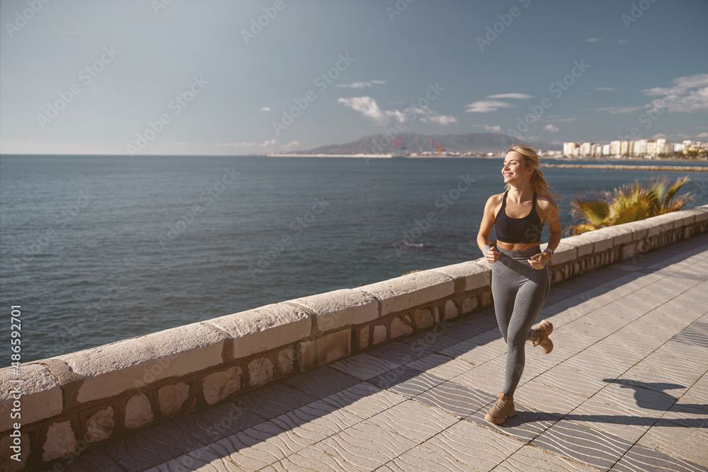 Shot of beautiful fitness woman on street workout