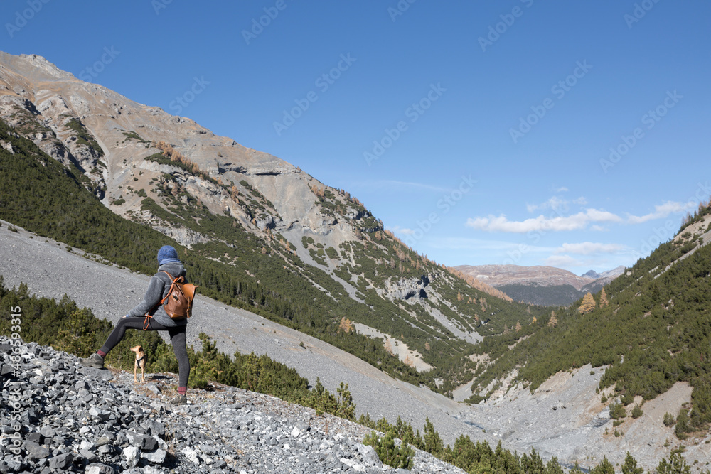 Trekker woman with mountains Trekker woman with mountains