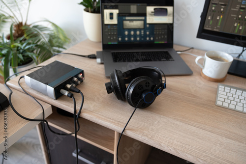 Headphones And Laptop On Tabletop photo