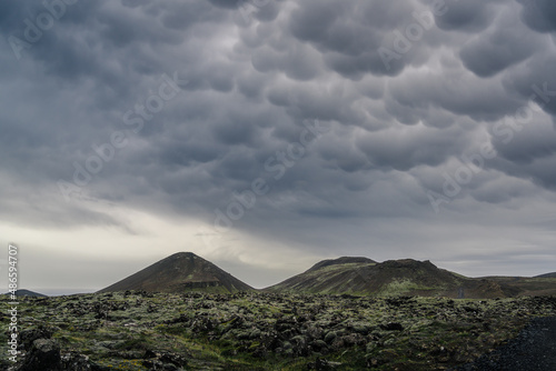 Mammatus clouds over wild volcanic landscape. photo
