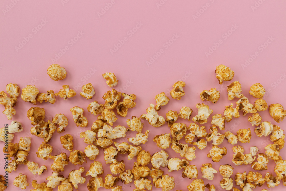 caramel popcorn on pink background, sweet snacks caramel popcorn on pink background, sweet snacks