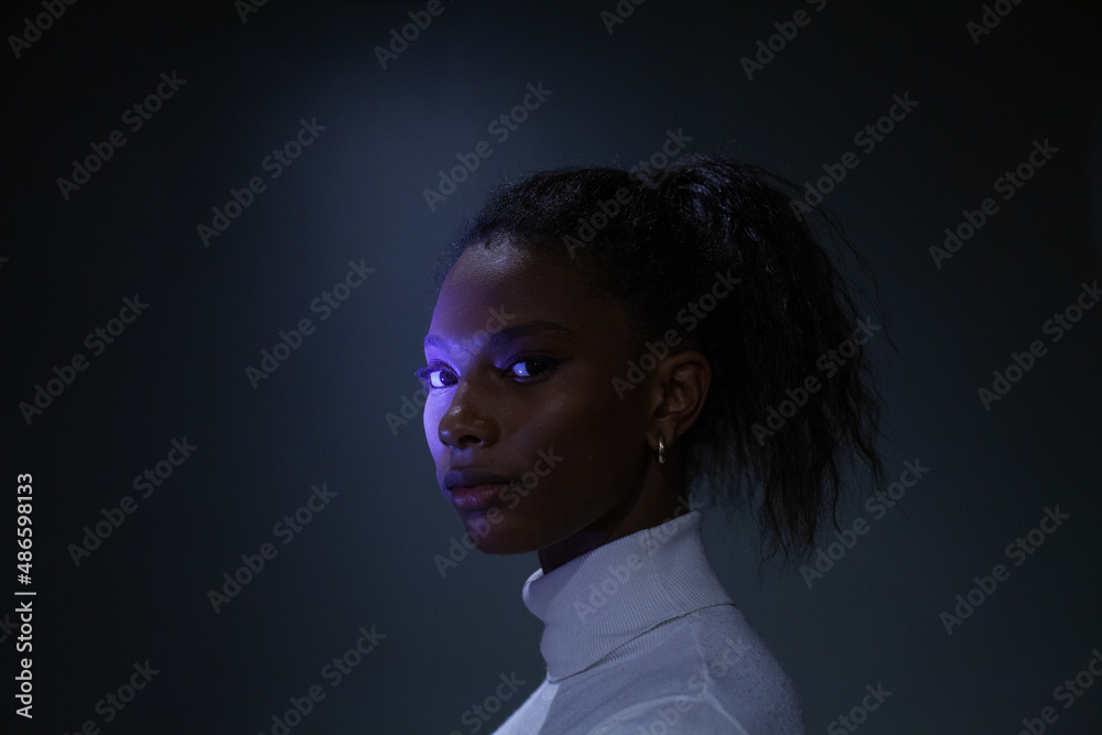 young woman studio portrait looking at camera