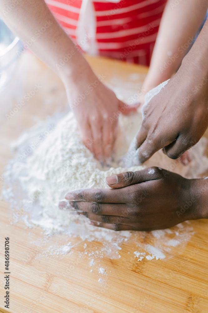 Close up of hands Baking together Close up of hands Baking together