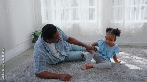 African American father arguing with daughter in toddler preschool age, girl look angry does not want to listen. Loving african American father talk with upset preschooler daughter. Family stressful.