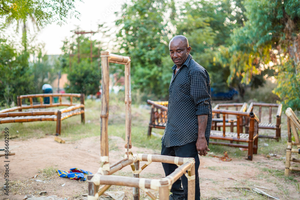 Man working with wood in countryside Man working with wood in countryside