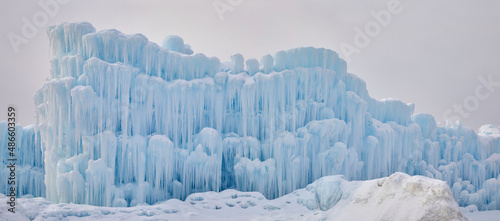Panorama ice wall with dripping and freezing water making a beautiful winter formation out of giant icicles
