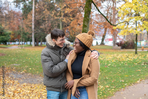 hug, couple laughing outside, rainy cold weather