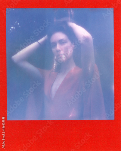 a dreamy woman in red dress photo
