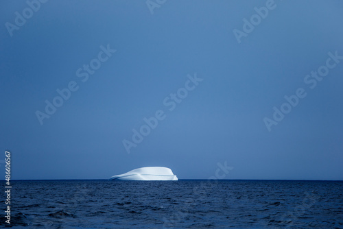 Icebergs floating in the melting sea ice in the Davis Strait. photo