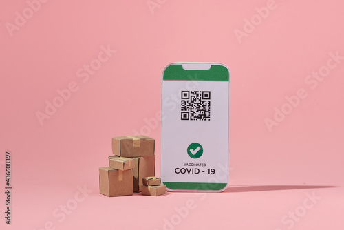 Smartphone with cardboard boxes photo