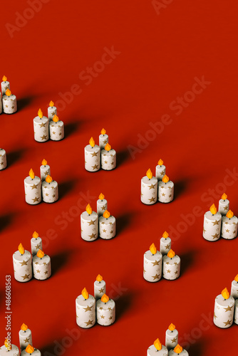 Cartoon Christmas candles on red copy space photo