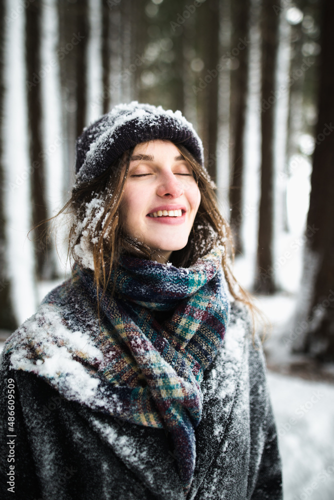 Portrait of teenage girl in hat covered with snow Portrait of teenage girl in hat covered with snow